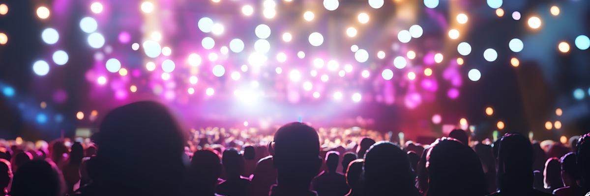 Crowd watching a stage with blurred lights