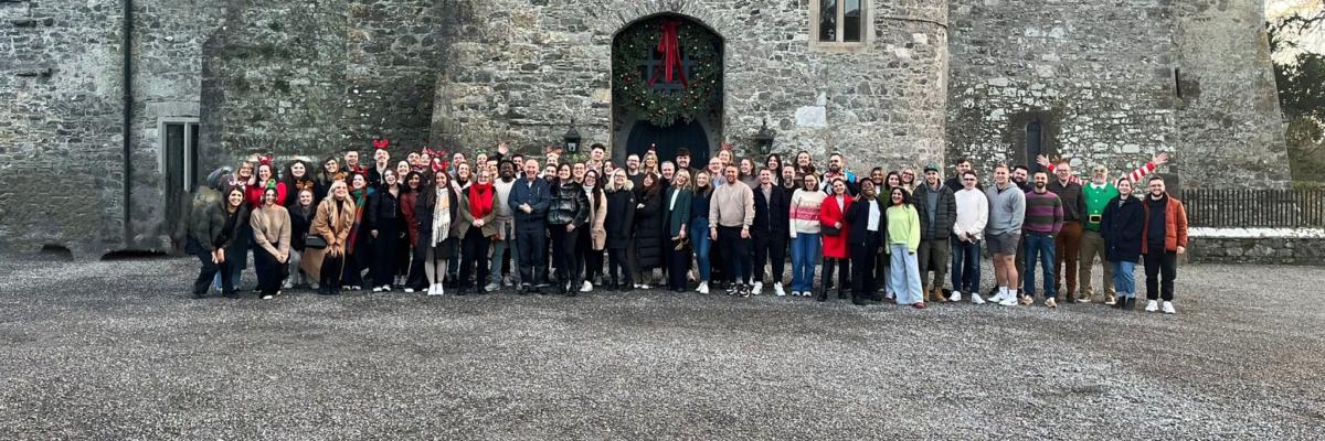 CTL Comms Company stood infront of a castle for their christmas party 