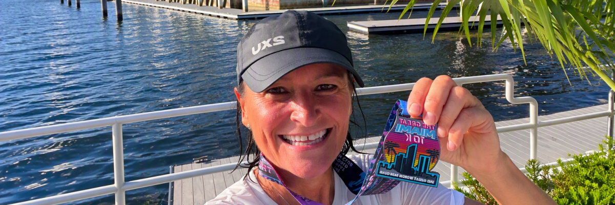 Catherine Turner with her Miami 10K medal 